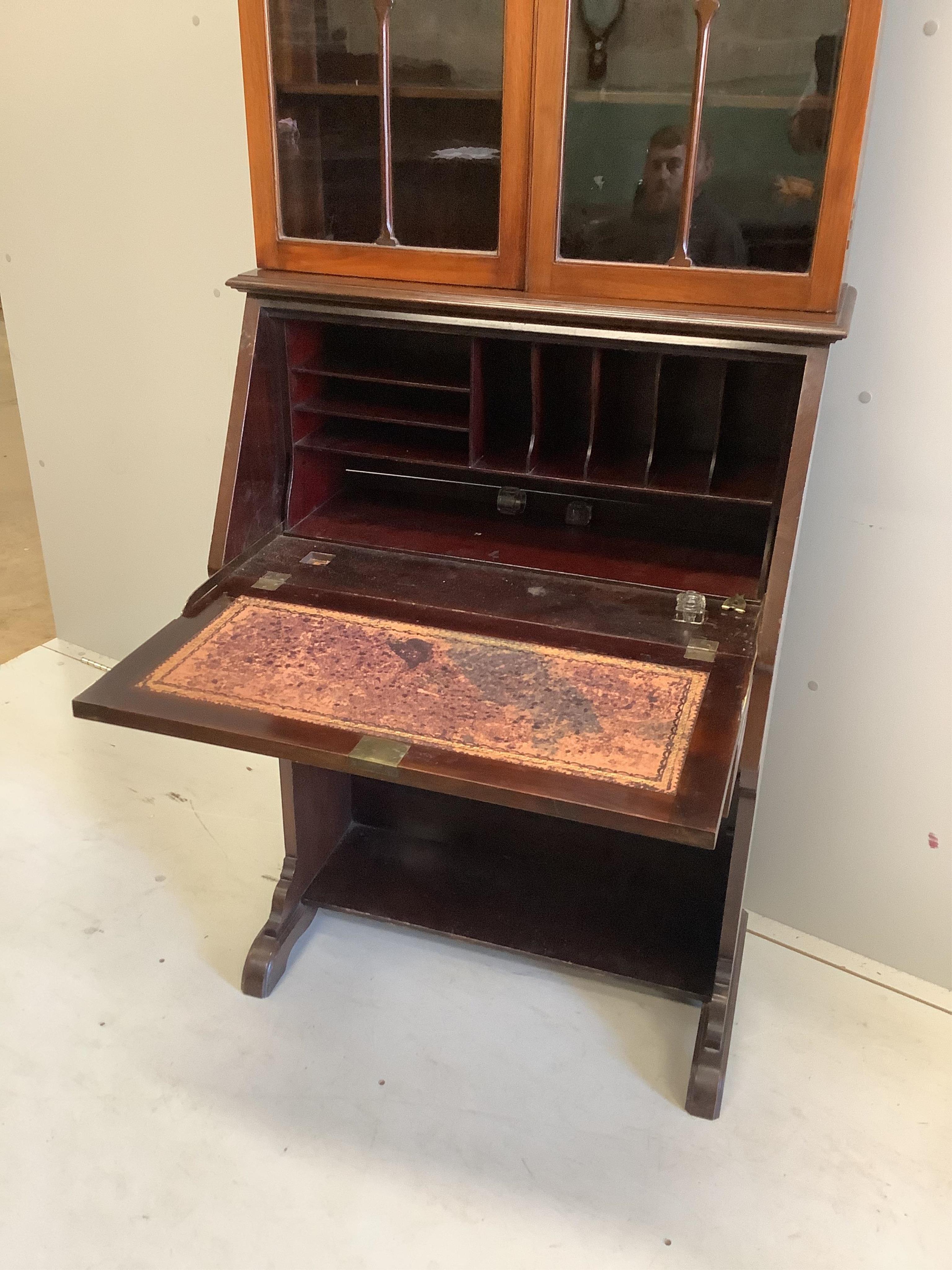 An Edwardian mahogany blind fret bureau cabinet, width 74cm, depth 38cm, height 194cm. Condition - fair